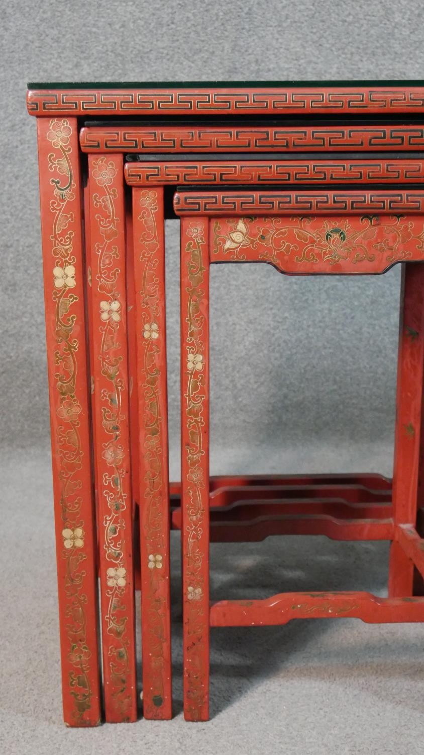 A quartetto of Chinese red lacquered occasional tables, of rectangular form, painted with figures in - Image 8 of 11