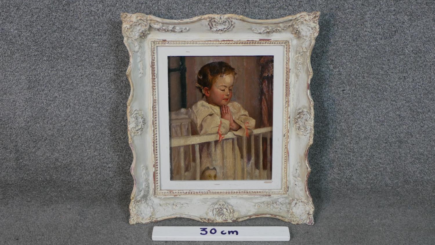 A carved framed oil on canvas of a child praying in her cot. Unsigned. H.47 W.43cm. - Image 3 of 7