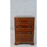 A mahogany stereo cabinet in the form of a George III bachelors chest, the top and faux drawers
