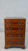 A mahogany stereo cabinet in the form of a George III bachelors chest, the top and faux drawers