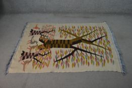 A hand made beige ground Indian Kelim tree of life design rug. H.170 W.116cm