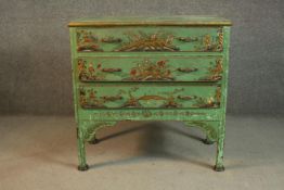 A circa 1920s Chinoiserie green painted chest of three long drawers, painted and gilded with typical