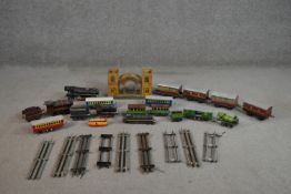 A collection of sixteen Hornby die cast locomotives, track and waiting room. H.16 W.27 D.12cm (