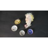 A collection of porcelain, including an Art Deco relief wall plaque of a blonde female, impressed