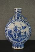 A late 19th-early 20th century Chinese large blue and white porcelain moon vase, decorated with a