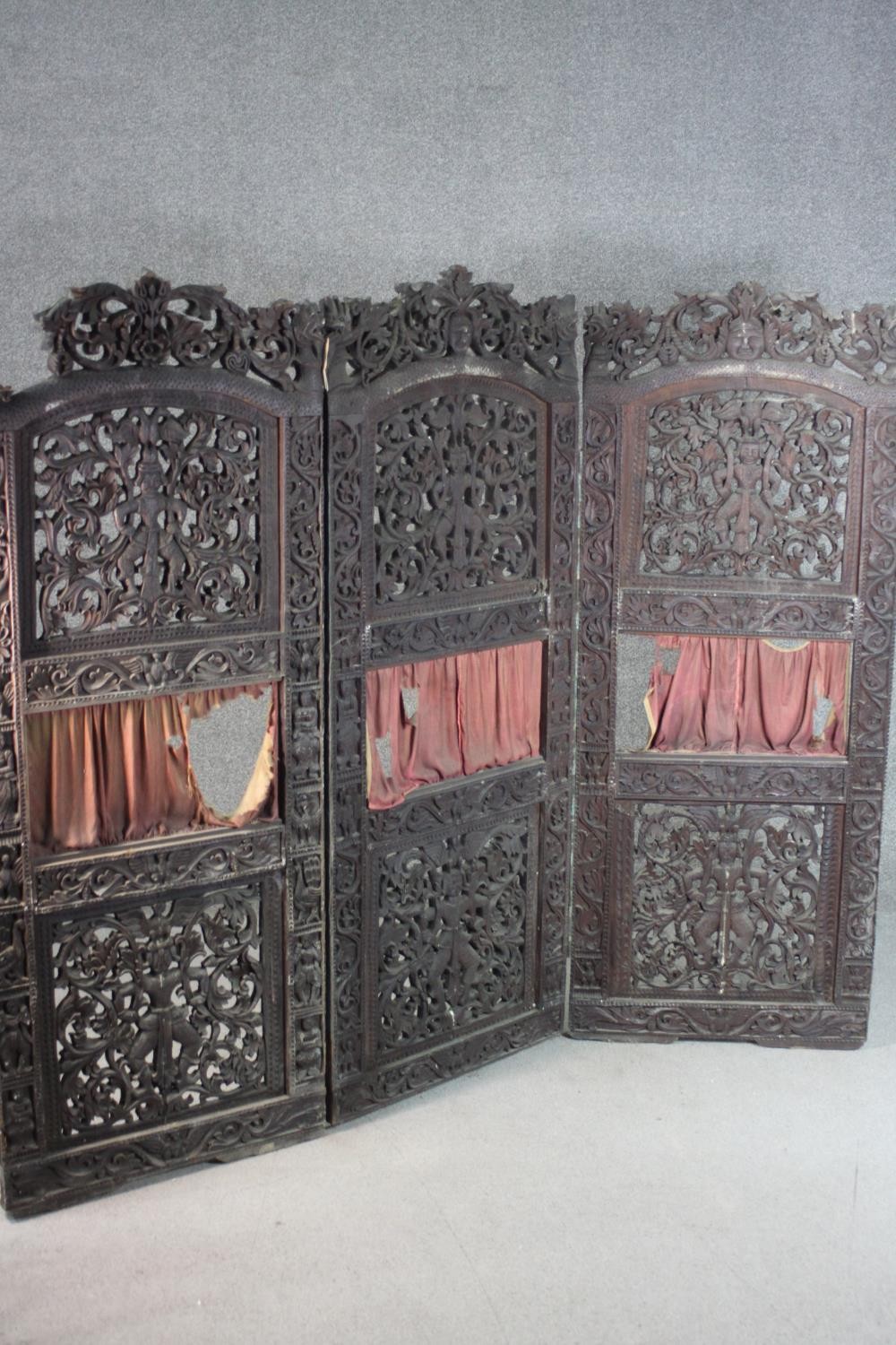 An ornately carved and pierced wood screen, possibly Burmese, of three folds, each with two panels - Image 7 of 7