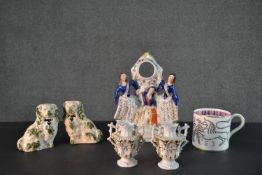 A collection of ceramics and porcelain, including a pair of Staffordshire pottery spaniels, a