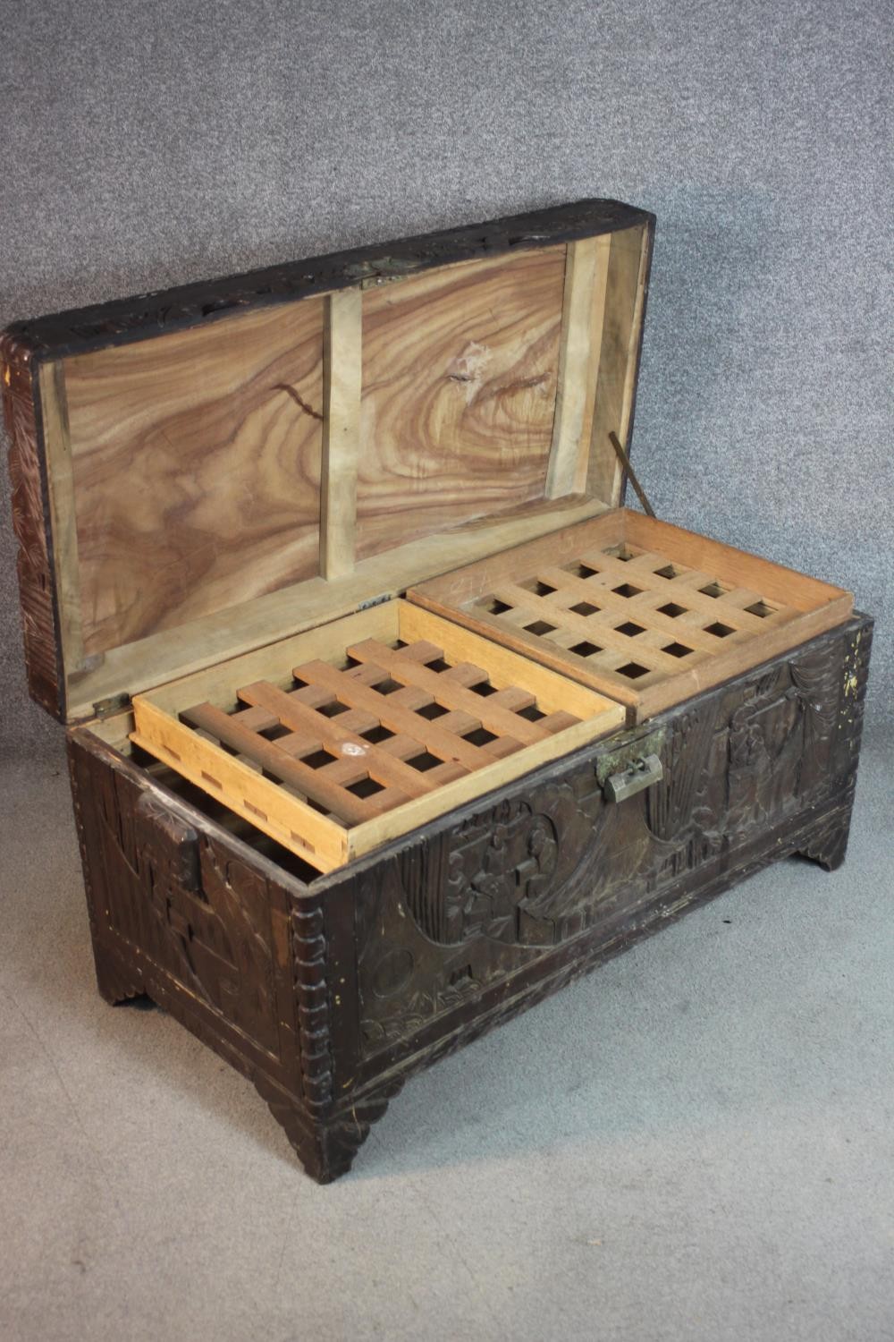 An early 20th century Chinese camphorwood chest, the exterior carved allover with figures amongst - Image 4 of 11