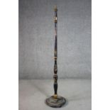 A circa 1920s Chinoiserie standard lamp, black lacquered and parcel gilt, with a turned stem on a