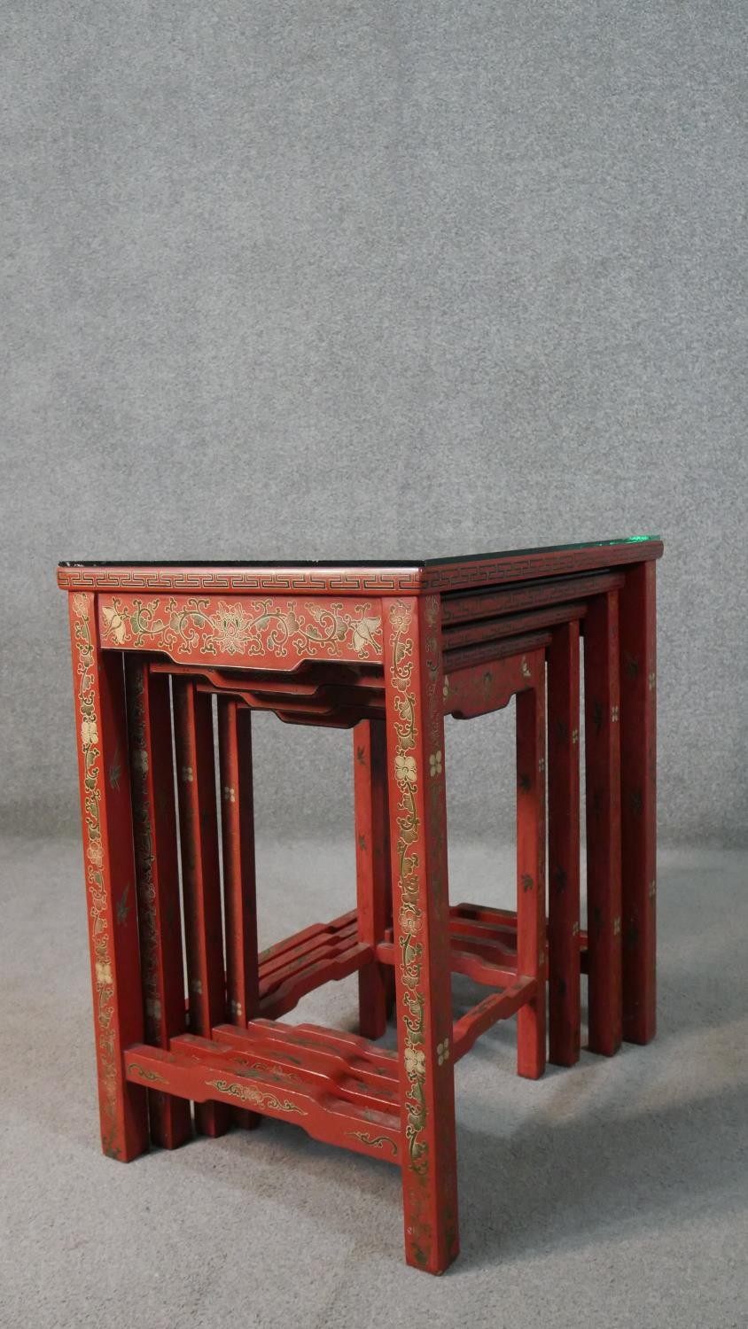 A quartetto of Chinese red lacquered occasional tables, of rectangular form, painted with figures in - Image 10 of 11