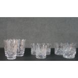 A collection of eleven cut crystal glasses, including a set of three Edinburgh crystal whisky