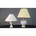 Two hand painted ceramic table lamps, one with a blue and yellow geometric design and the other with