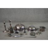 A collection of pewter and silver plate, including a pair of Victorian silver plated candlesticks, a