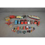 A collection of vintage tinplate and die cast vehicles and scenery, including Corgi, Trade Mark