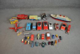 A collection of vintage tinplate and die cast vehicles and scenery, including Corgi, Trade Mark
