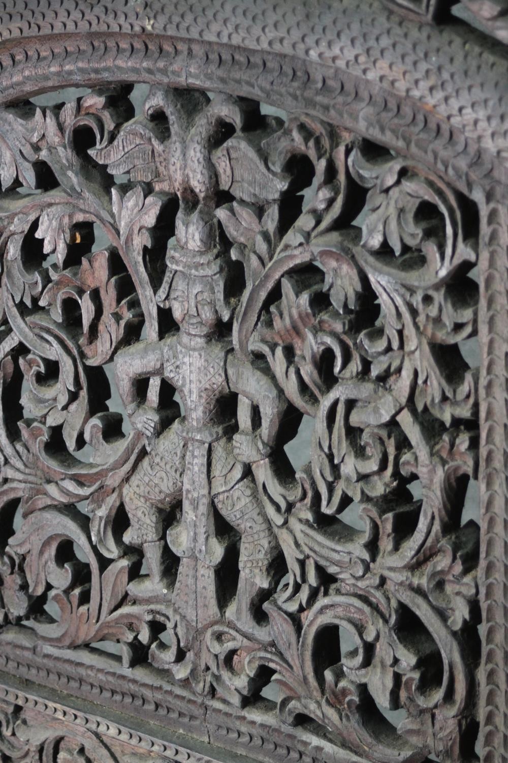 An ornately carved and pierced wood screen, possibly Burmese, of three folds, each with two panels - Image 3 of 7