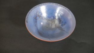 A terracotta blue glaze art pottery bowl, around the rim a hand written quote by Søren