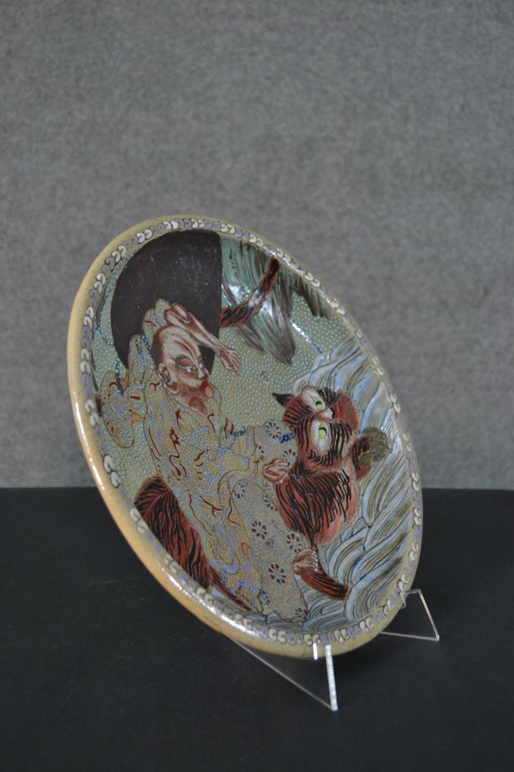 A Japanese 19th century Kutani ware bowl with an immortal riding a tiger, cloud motifs to the - Image 5 of 11