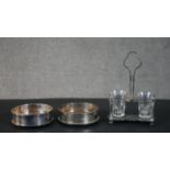 Two oak and silver plated wine coasters along with a silver plated Christofle, Paris salt cellar.
