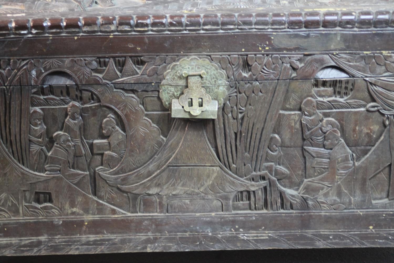 An early 20th century Chinese camphorwood chest, the exterior carved allover with figures amongst - Image 6 of 11