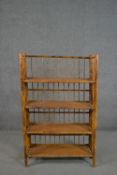 A set of folding bamboo bookshelves, with spindle back and sides, and four shelves. H.110 W.69 D.