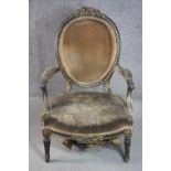 A 19th century painted and parcel gilt fauteuil open armchair, upholstered in brown velour to the