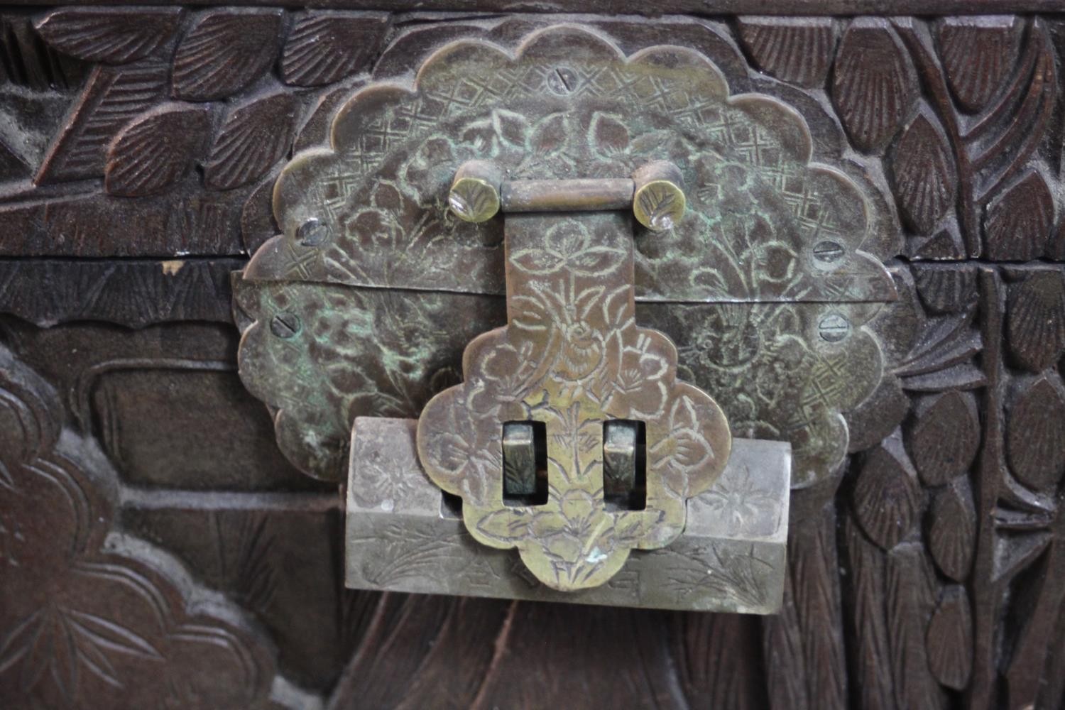 An early 20th century Chinese camphorwood chest, the exterior carved allover with figures amongst - Image 10 of 11