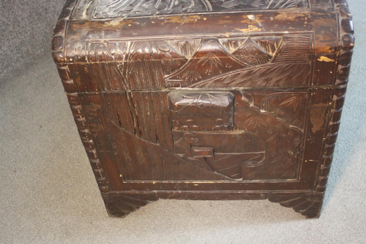 An early 20th century Chinese camphorwood chest, the exterior carved allover with figures amongst - Image 5 of 11
