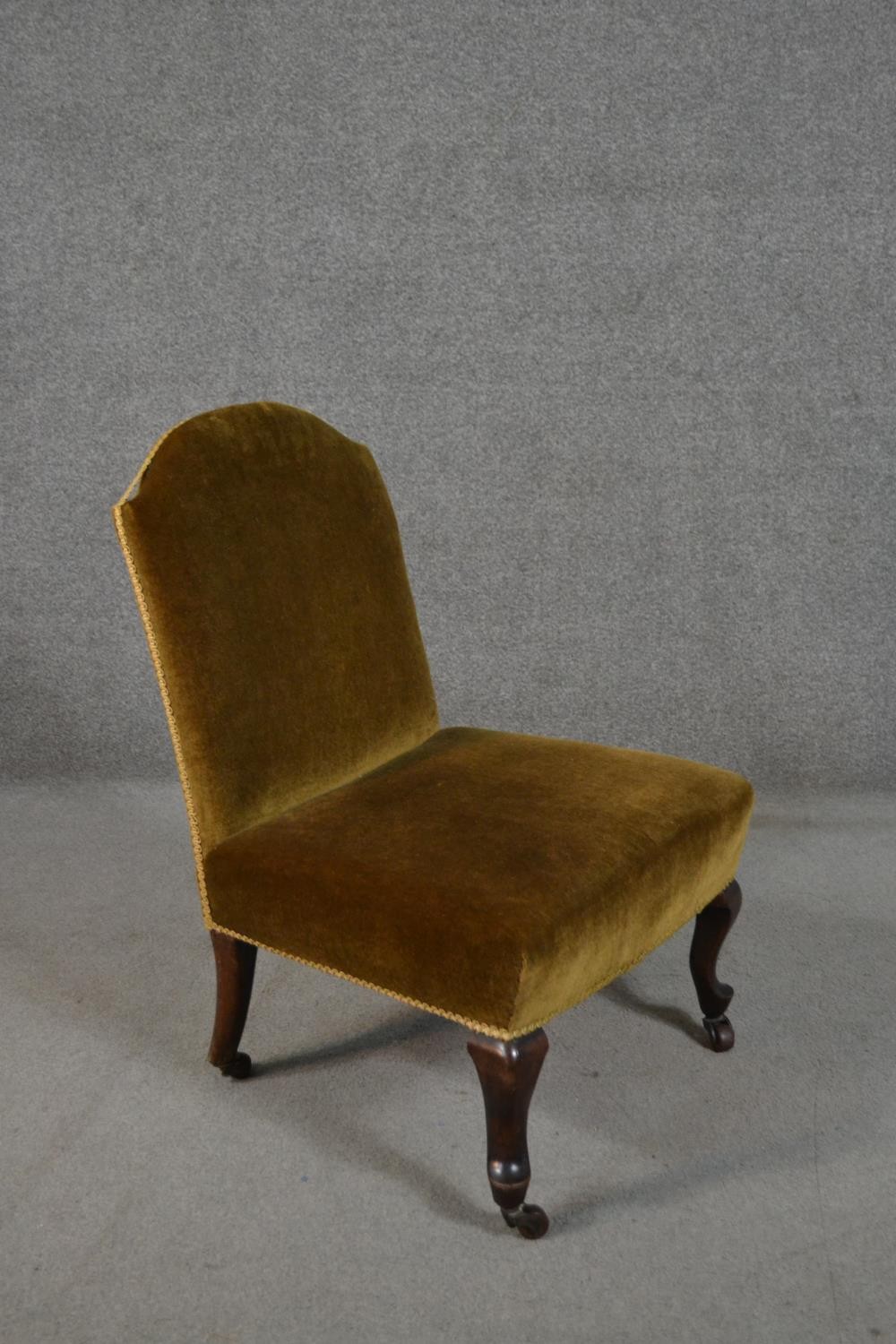 A late Victorian nursing chair, upholstered in golden velour, on mahogany cabriole legs. - Image 2 of 5