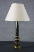 A green marble effect and parcel gilt tole ware table lamp, of column form, with a square base,
