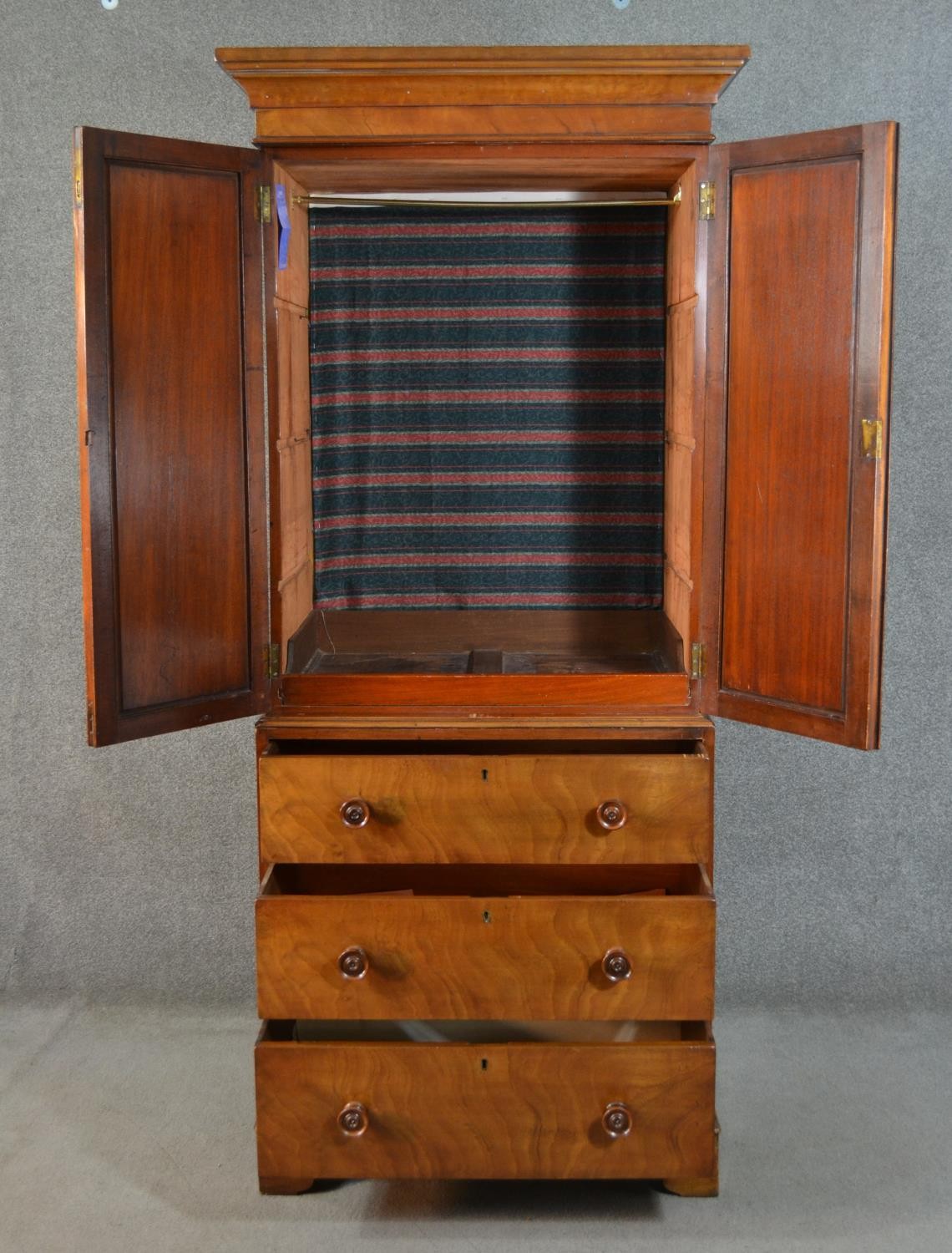 An early 19th century mahogany linen press, of narrow proportions, with two cupboard doors, - Image 4 of 7