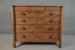 A circa 1830s mahogany chest, with three short hidden reeded drawers, over four long graduated