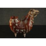 A terracotta Peruvian folk art jug in the form of a bull with hand painted white glaze design. H.