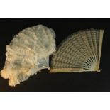 A white ostrich feather and mother of pearl ladies 19th century fan along with a lace and carved