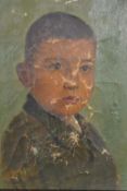 A framed early 20th century oil on canvas of a young boy, indistinctly signed and dated 1924