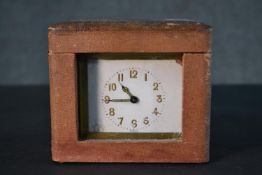 A 19th century French brass carriage clock with leather travel case. White enamel dial with black