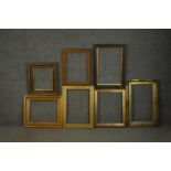 A collection of seven picture frames, including four giltwood and gesso frames, some with floral and