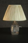 A 19th century cut glass decanter, converted to a table lamp, with a diamond cut body and a