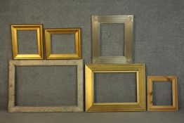 A collection of six picture frames, including a pair of giltwood frames and a carved foliate