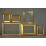 A collection of six picture frames, including a pair of giltwood frames and a carved foliate