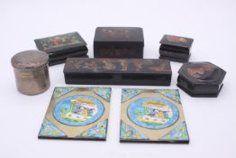 A collection of curiosities, including two enamelled Chinese brass plaques with figural design, a