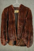 A vintage Herbert Duncan red/brown mink fur waist length jacket, with silk makers label and black