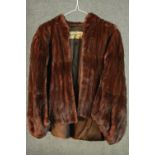 A vintage Herbert Duncan red/brown mink fur waist length jacket, with silk makers label and black