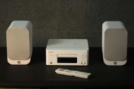 A Denon sound system wth Q Acoustic speakers.