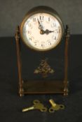 An early 20th century French gilt metal mantle clock with white enamel dial with rose swag