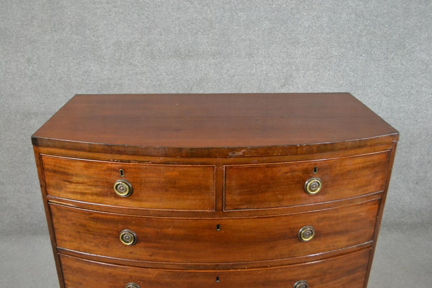 A George III mahogany bow front chest, of two short over three long graduated drawers, above a - Image 3 of 6