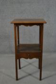 A George III mahogany bedside table, with a square top over an undertier, with a single drawer, on