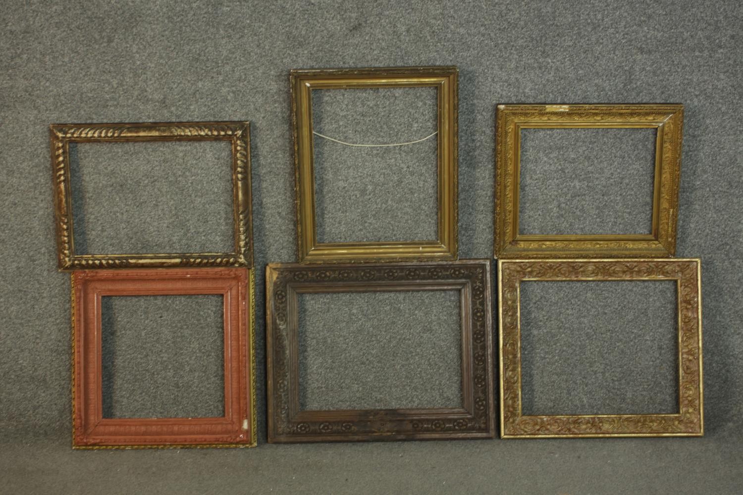 A collection of six picture frames, including four giltwood and gesso frames, with various