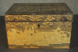 A Japanese Meiji period black lacquered box, gilded allover with detailed scenes depicting people