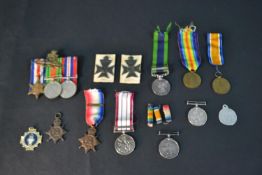 A collection of military medals and badges for W Yates: including the 1914 star, two British War